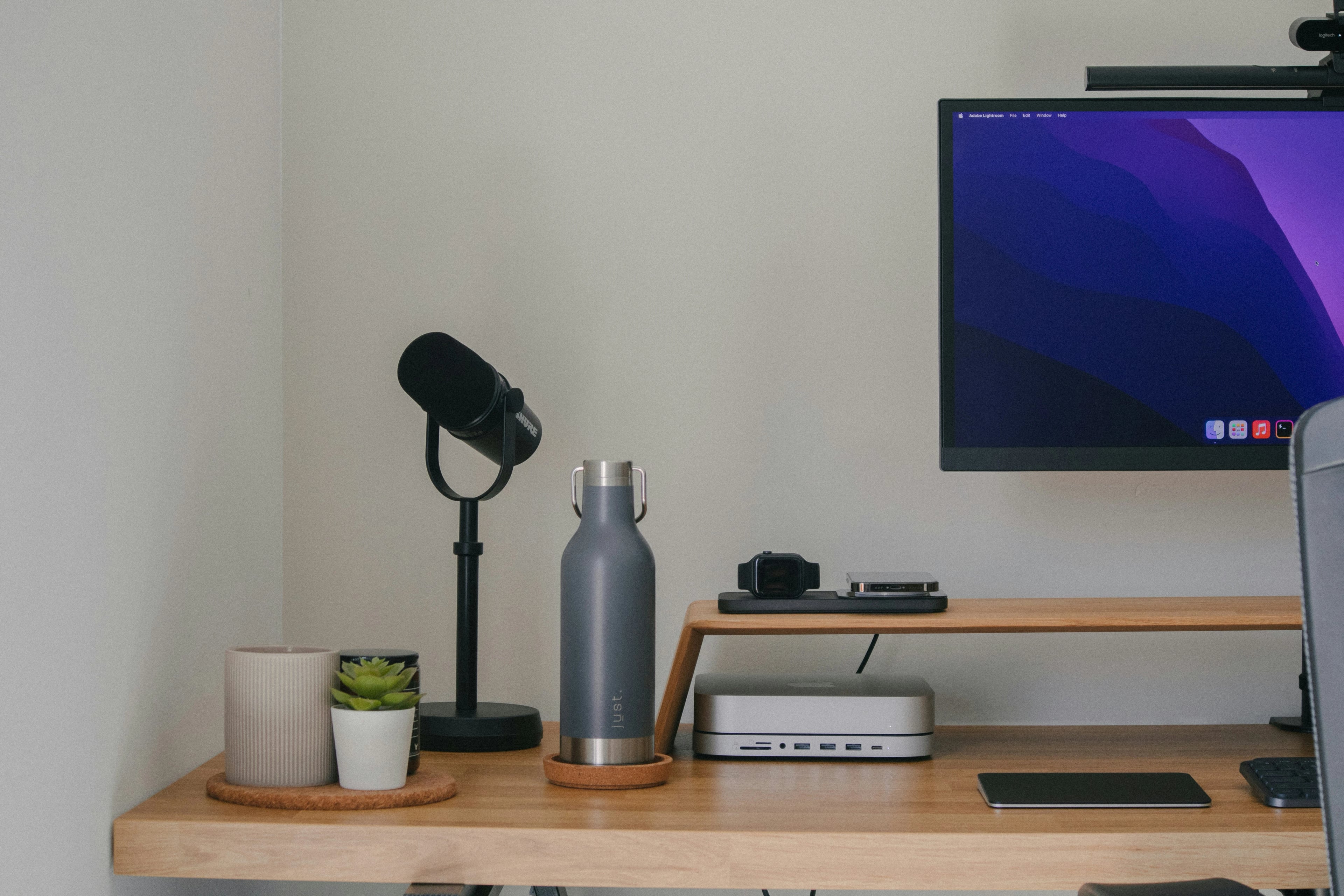 Professional web developer workspace with modern devices and UI design elements, representing productivity and creative digital solutions.
